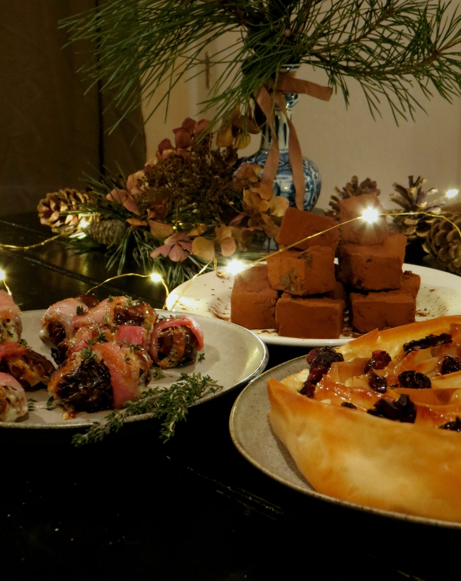 Freshly baked scone, with jam and cream. Antique knife on ivory late with cream on it and more scones in background. 