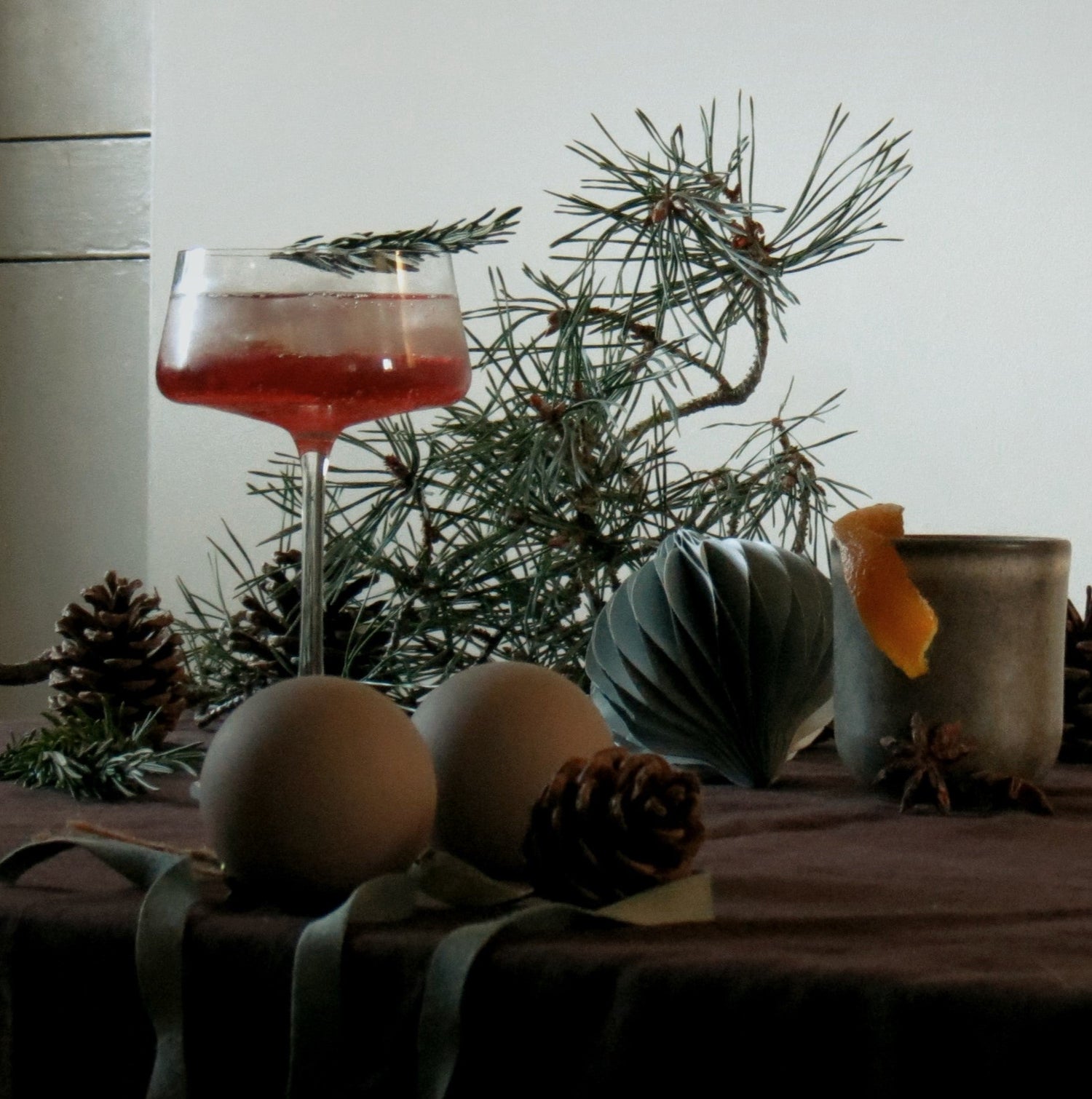A Cocktail in tumbler with mint and lime. 