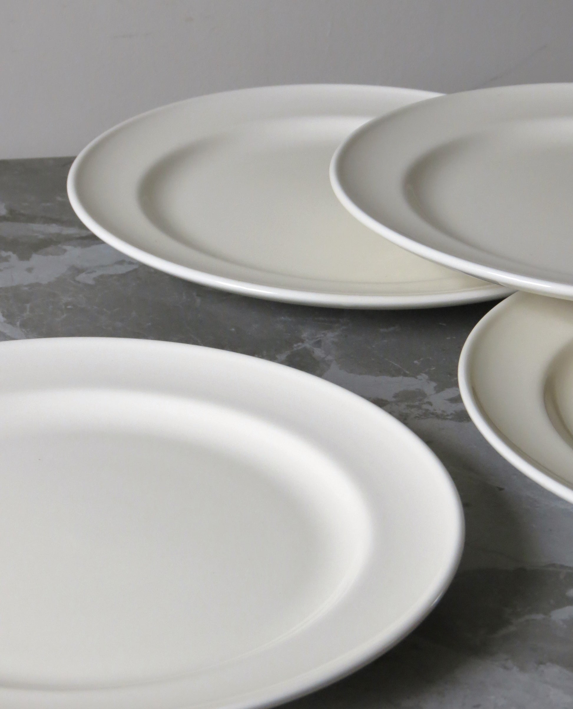 Dinner plates on grey stone service. 