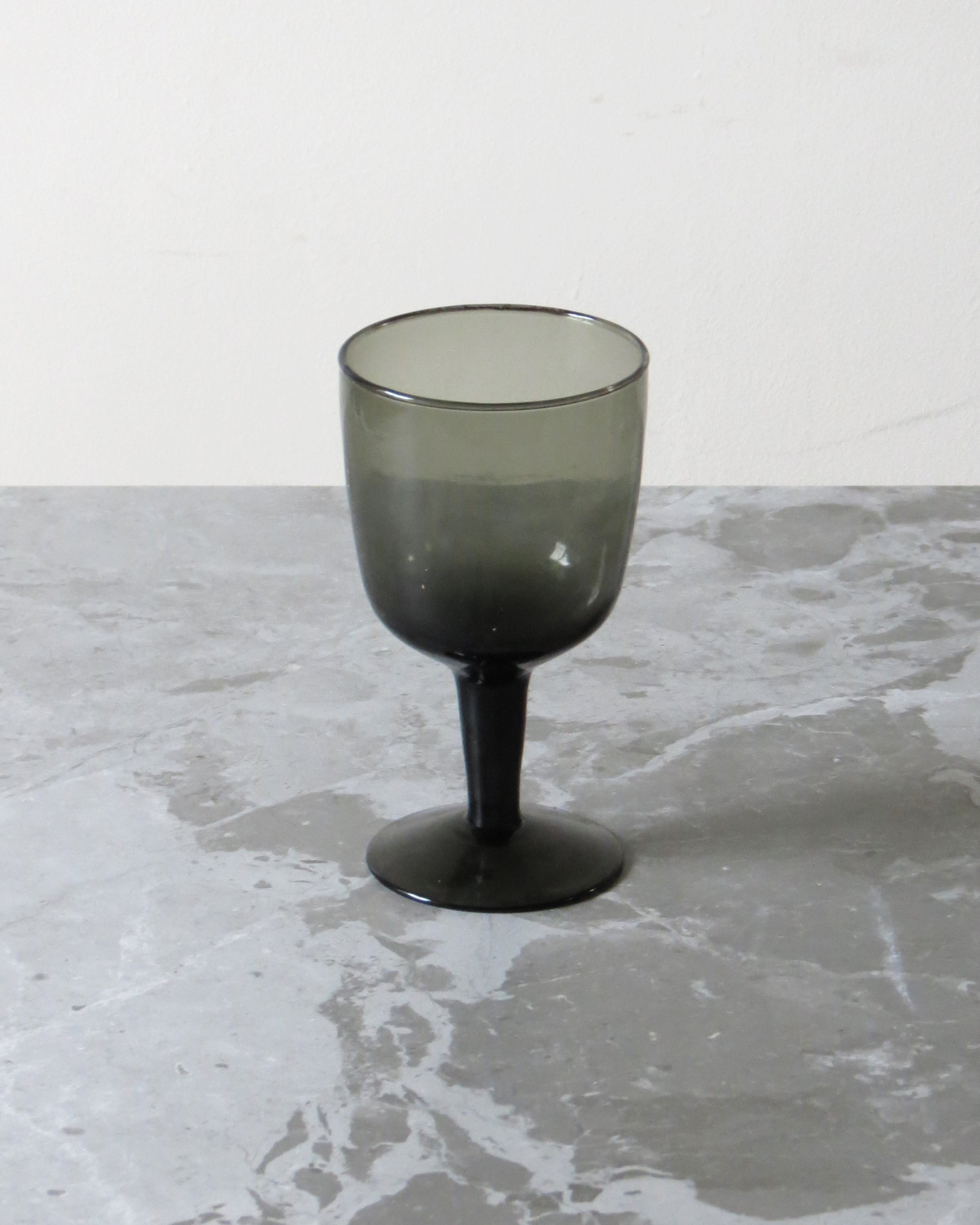 Smoked glass on a marble surface