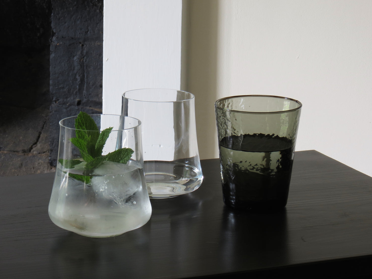 Tree tumblers in two styles on dark service and light background 